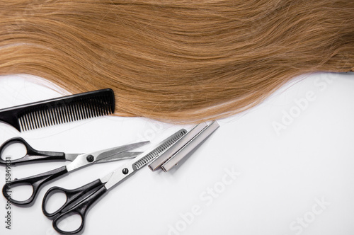 Hair and hairdresser items scissors, comb, clipper on a white background