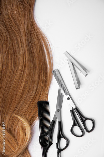 Hair and hairdresser items scissors, comb, clipper on a white background