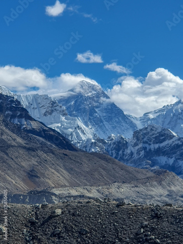 View on Everest  Nuptse and other great mountains. Near Ngozumpa Tsho  the fifth Gokyo lake. Sunny day and marvellous blue sky. Gokyo lakes and Cho Oyu base camp trek  Solokhumbu  Nepal.