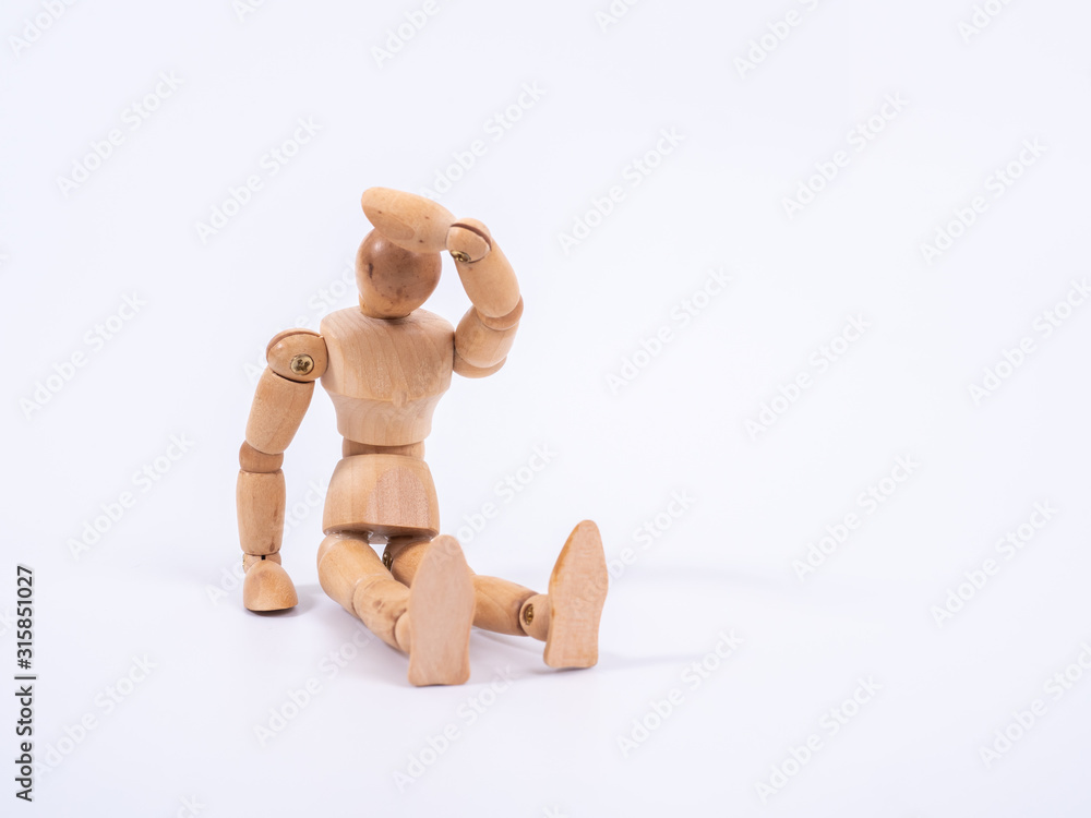The wooden dummy sits on white background The wooden dummy sits on white background