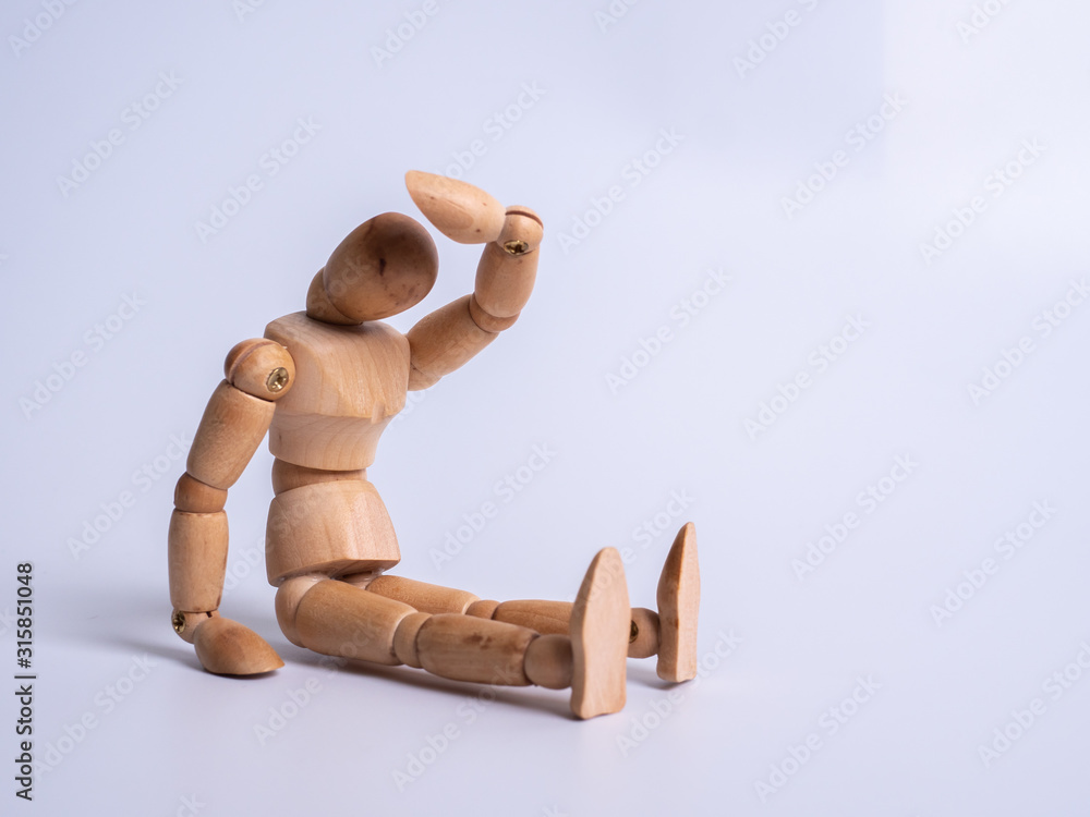 The wooden dummy sits on white background The wooden dummy sits on white background