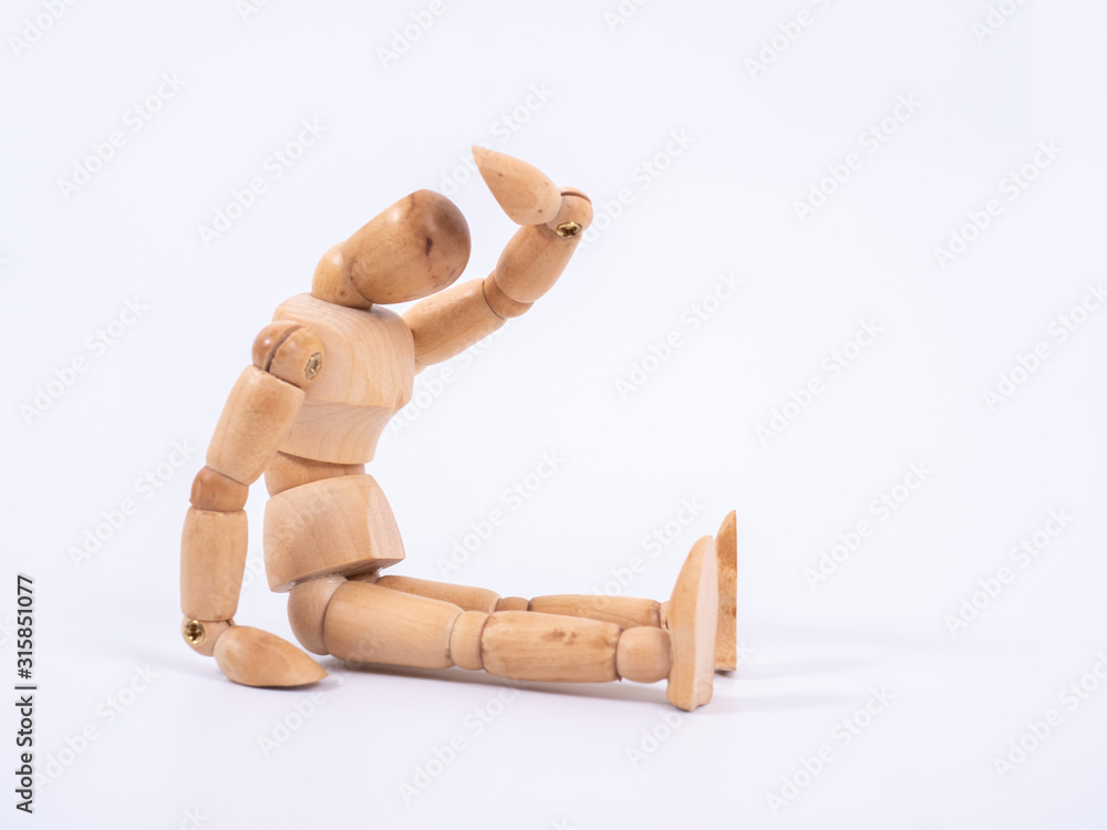 The wooden dummy sits on white background The wooden dummy sits on white background