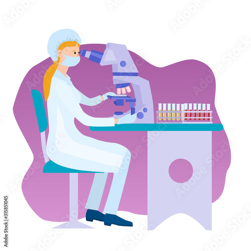Woman at the microscope. Lab technician examines