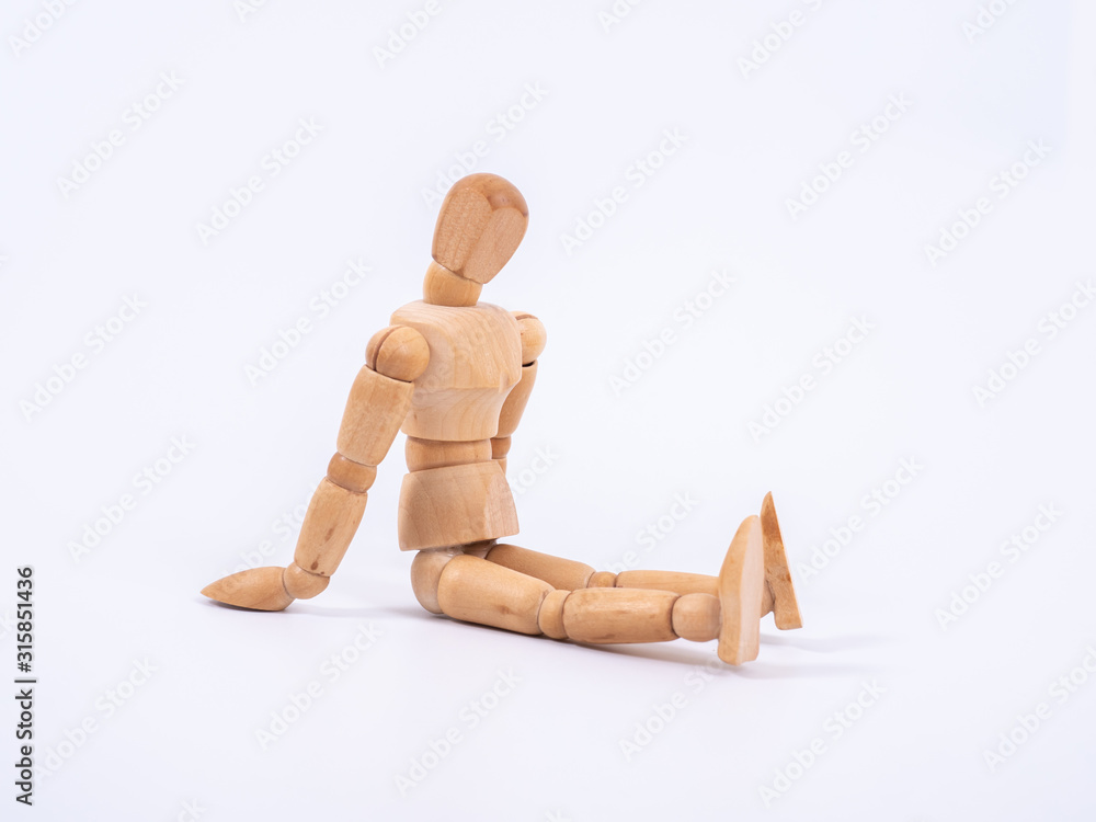The wooden dummy sits on white background The wooden dummy sits on white background