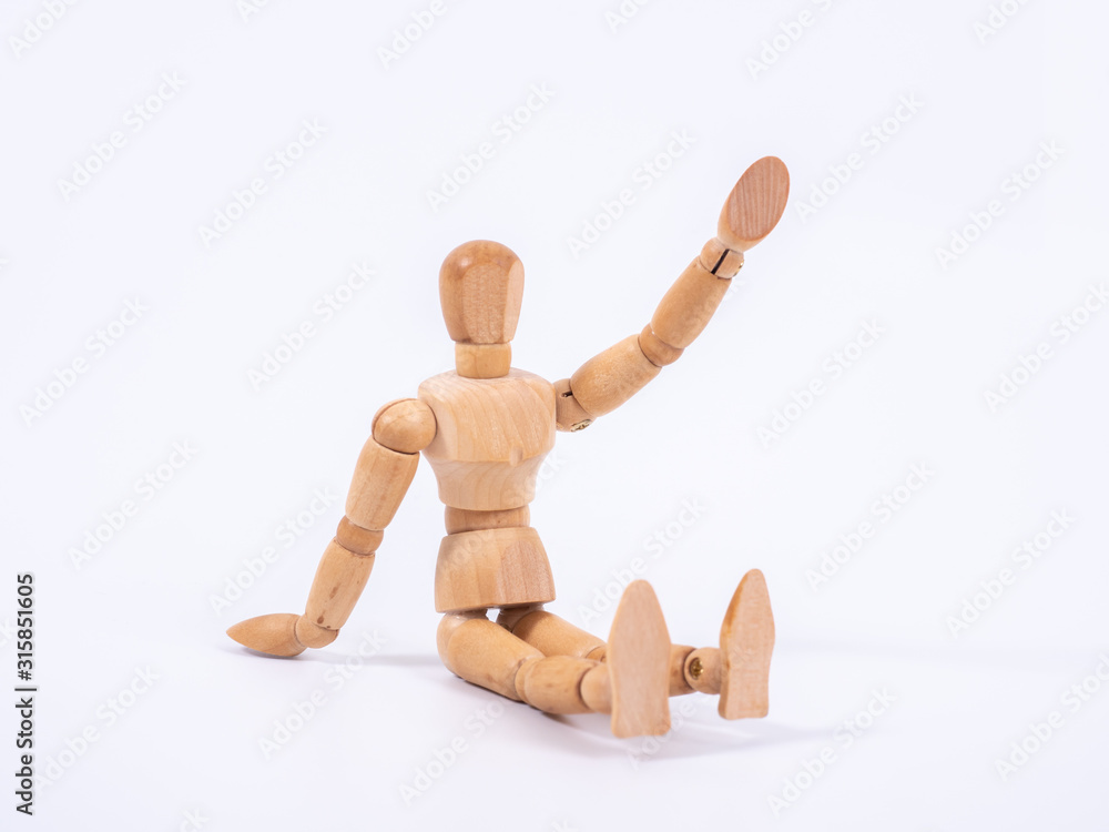 The wooden dummy sits on white background The wooden dummy sits on white background