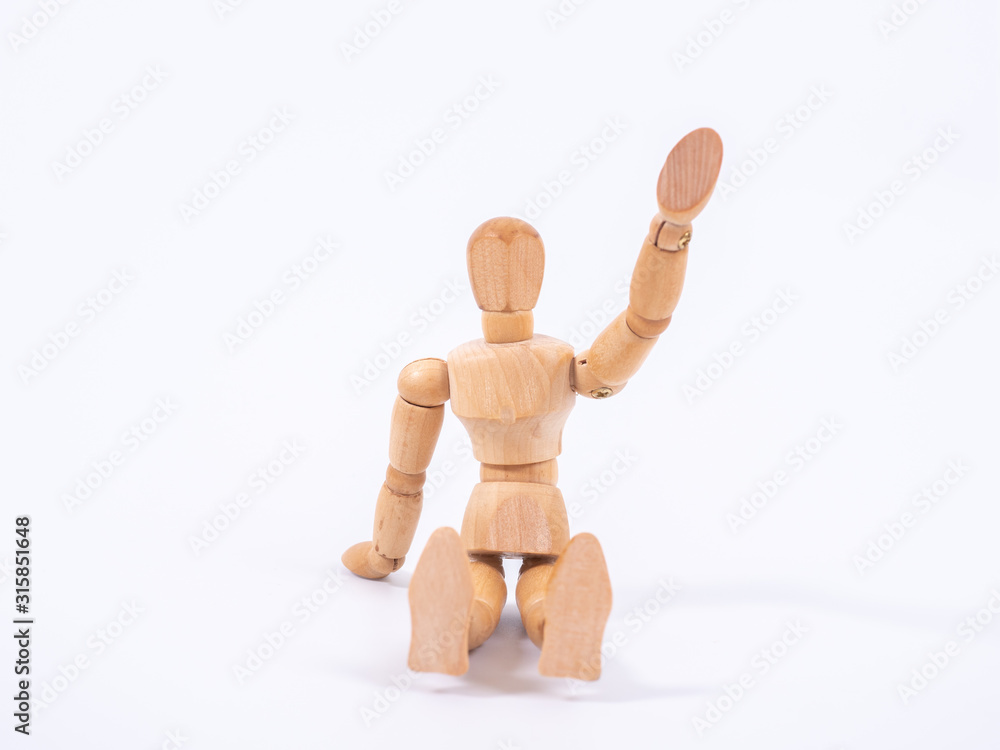 The wooden dummy sits on white background The wooden dummy sits on white background