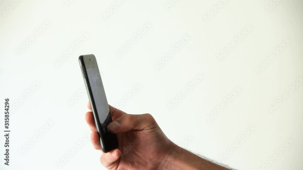 Close up of a man with smartphone taking pictures in office Close up of a man with smartphone taking pictures in office