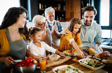 Portrait of happy family in kitchen at home