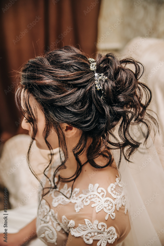 Brunette. Stylish hair styling. Hairstyle bride