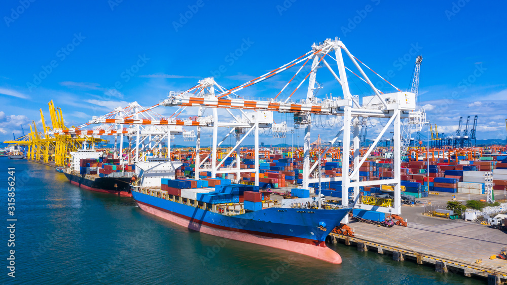 Container ship loading and unloading in deep sea port, Aerial view of ...