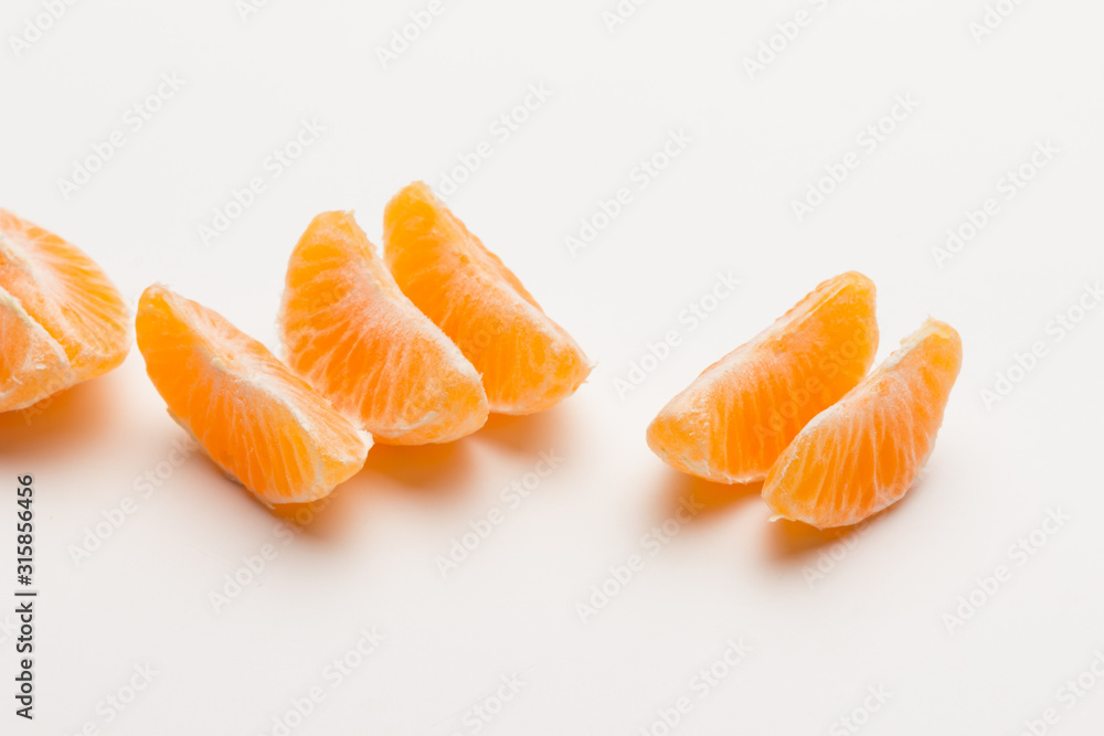 Tangerine orange-skinned sweet fruit of the citrus family.