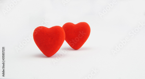 two red hearts on a white background