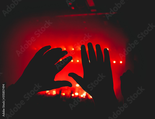 hands in the air at a concert