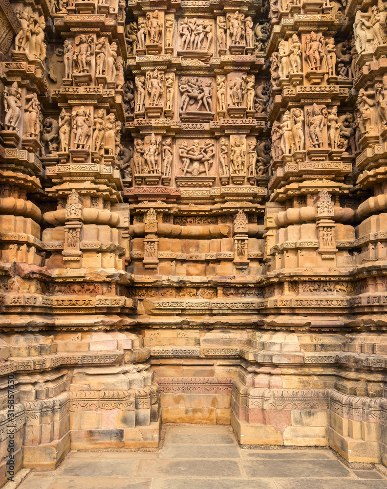 Close up of artful carved walls of Kandariya Mahadeva Temple, Khajuraho Group of Monuments, India Close up of artful carved walls of Kandariya Mahadeva Temple, Khajuraho Group of Monuments, India
