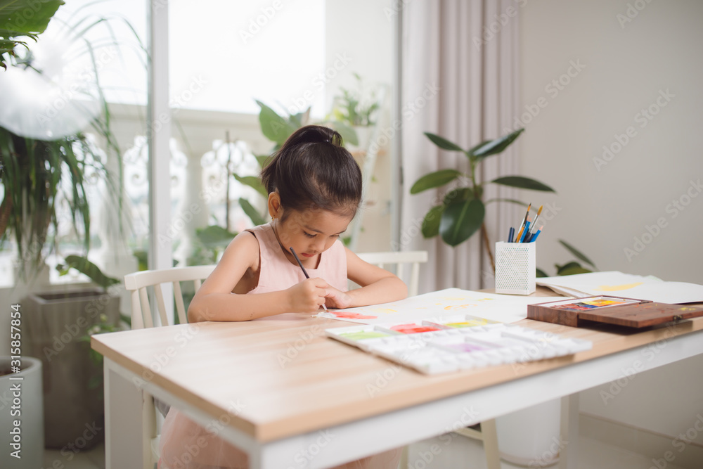 Going to school is your future. Education, learning, teaching. a young girl coloring a picture Going to school is your future. Education, learning, teaching. a young girl coloring a picture