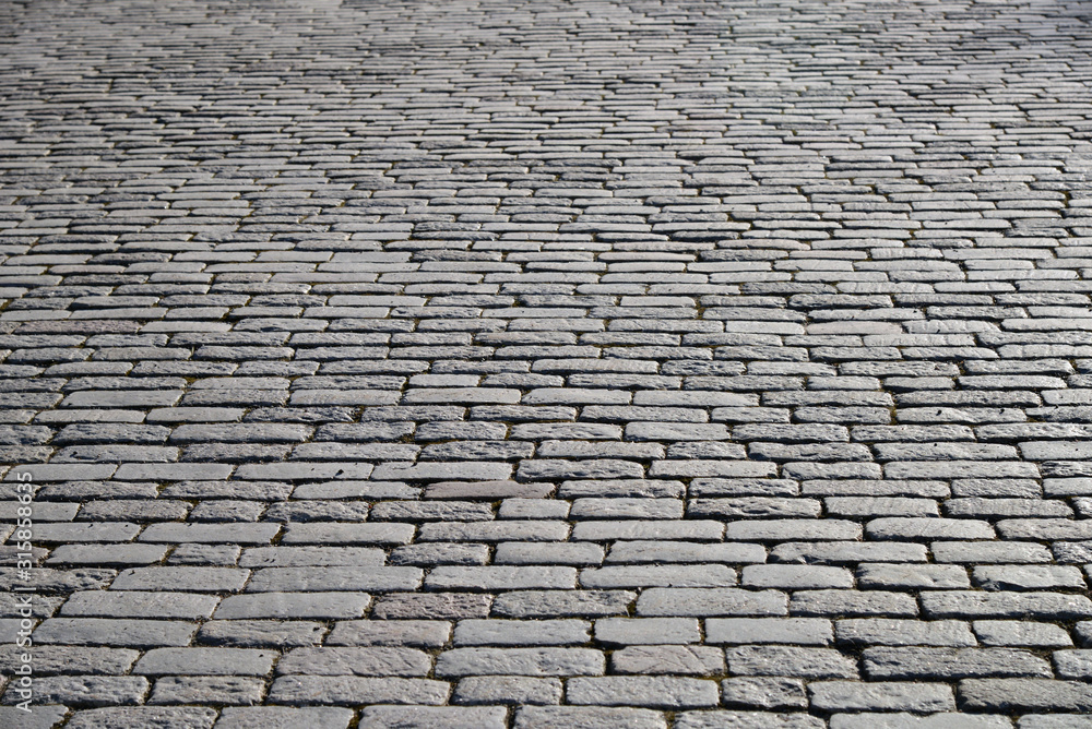 Old cobblestone pavement close-up.