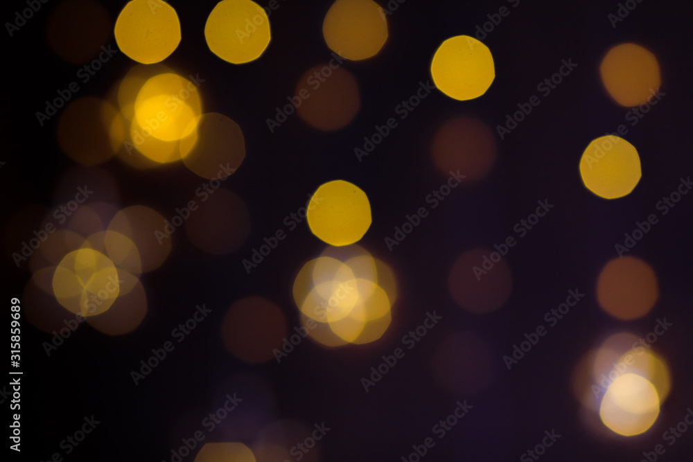 Obraz premium Christmas golden lights. Background of bright glow bokeh. - Image