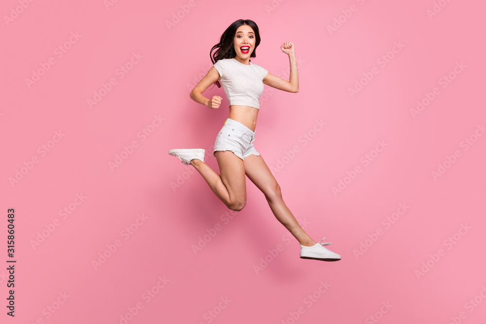 Full length body size view of her she nice-looking attractive lovely dreamy overjoyed cheerful cheery wavy-haired girl jumping having fun running isolated over pink pastel color background Full length body size view of her she nice-looking attractive lovely dreamy overjoyed cheerful cheery wavy-haired girl jumping having fun running isolated over pink pastel color background