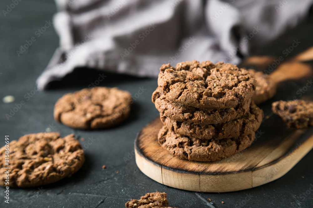 Fresh chocolate chip cookies on a dark background Fresh chocolate chip cookies on a dark background