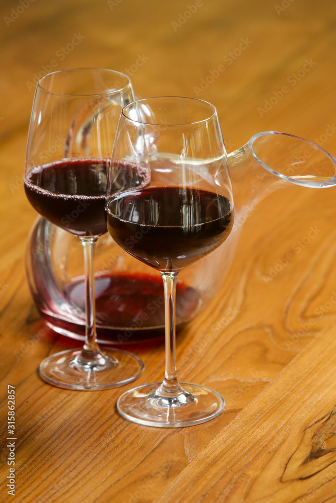 Wine decanter, wineglasses and red wine. Decanting wine ensures that the sediment stays in the bottle and you get a nice clear wine and second and more everyday reason to decant is to aerate the wine.