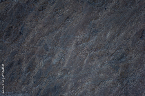 The texture of the old stone. Background. Space for text. Close-up.