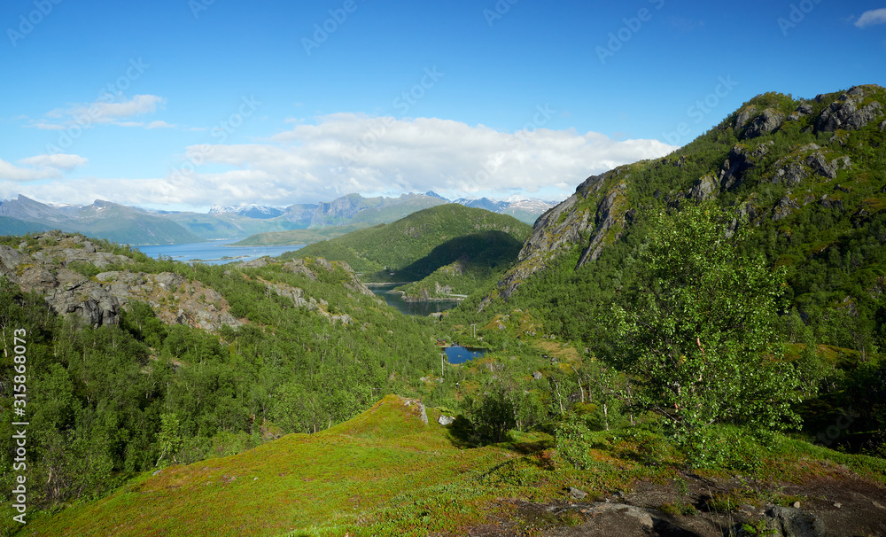 Scenic mountain view in mountainous summer terrain in northern Norway. Senja Island, Troms County - Norway. Beauty of nature concept background.