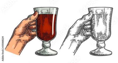 Female hand holding a glass of wine. Vintage vector engraving i