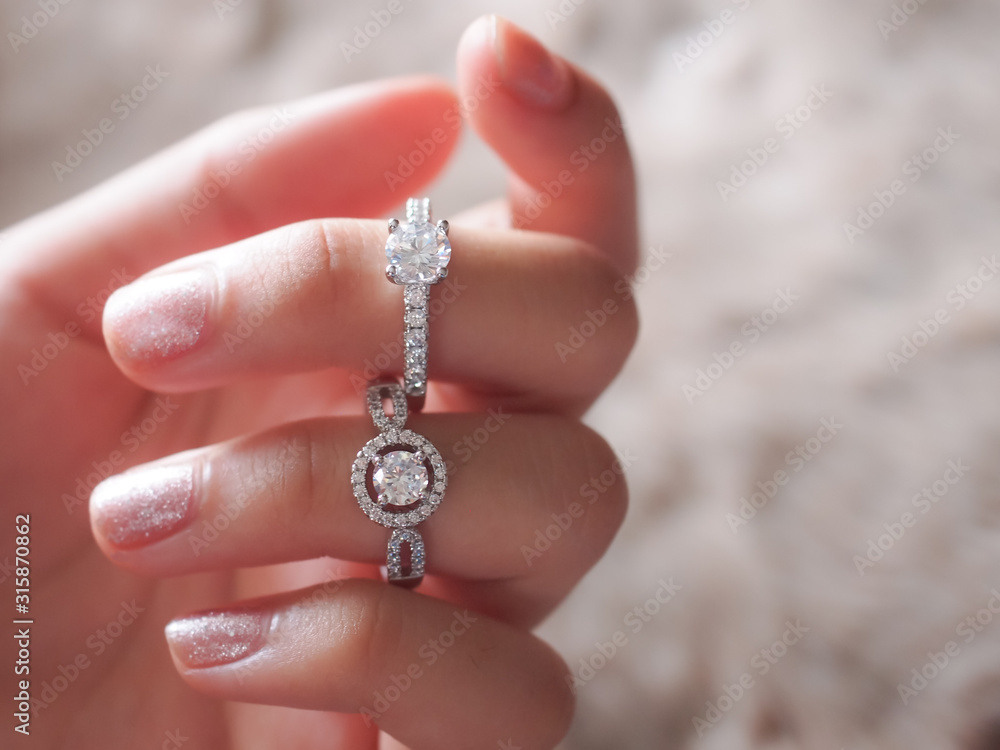 Closeup diamond ring elegant beauty on the woman finger.Love and wedding concept.