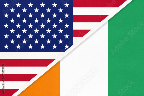 USA vs Ivory Coast national flag from textile. Relationship between two american and african countries.