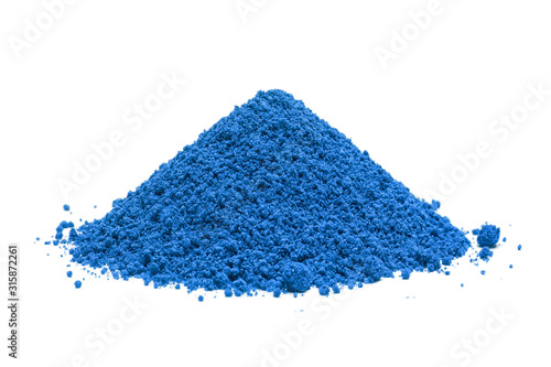 Pile of blue powder, isolated on white background photo