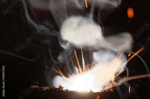 Macro photo of bursting gunpowder photo