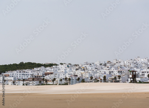 Panoramic view from beach to Andalusian town Conil de la Frontera  Cadiz province  Costa de la Luz  Spain