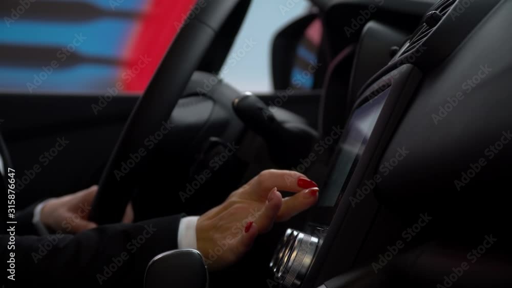 A woman use the sensor in car A woman use the sensor in car