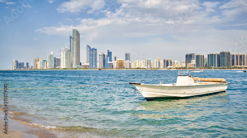 Motor boat with Abu Dhabi skyline at the background