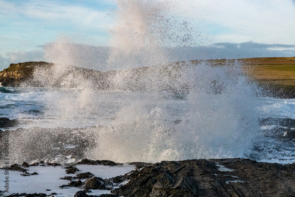 Spray from a large wave hitting the Cornish coast in January