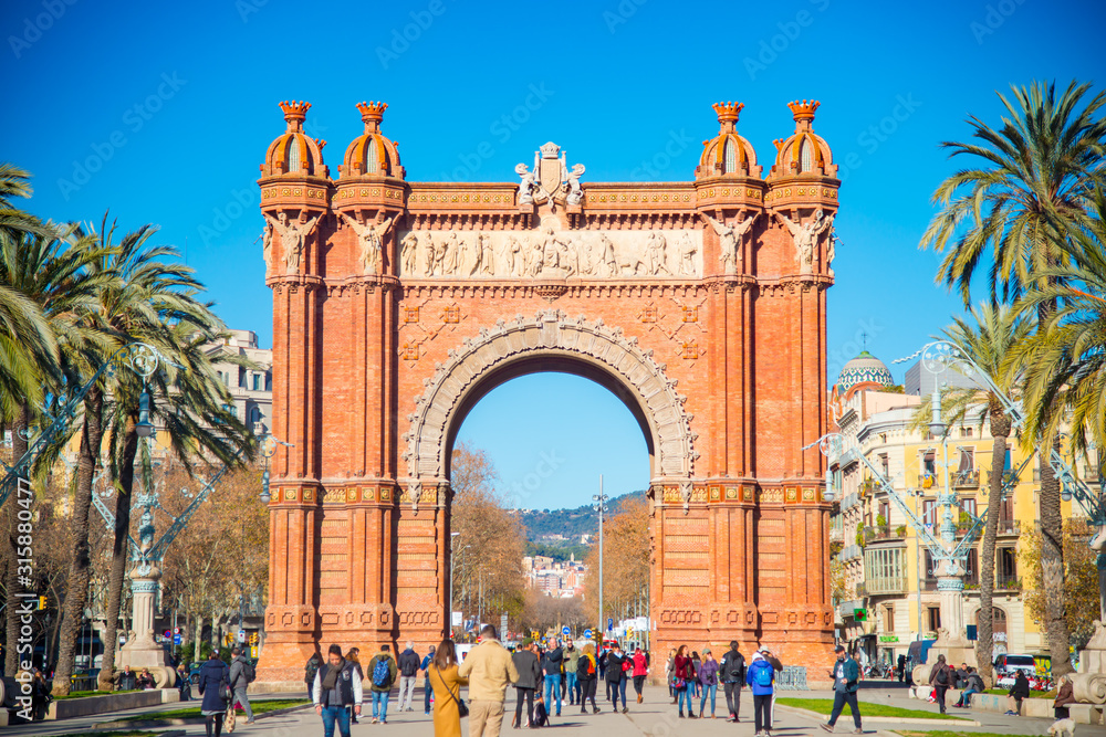 Obraz premium BARCELONA, SPAIN - January 30, 2019: Arc de Triunfo is located in Barcelona, Spain. Barcelona is known as a big tourist destination. .