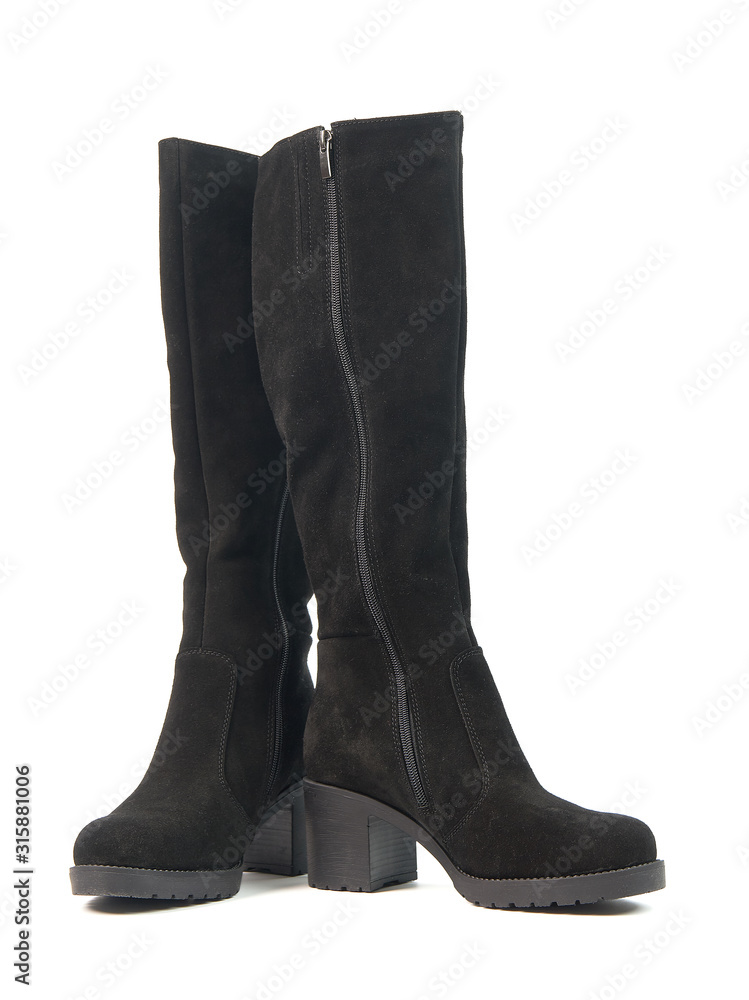 Elegant women's tall black winter high heeled boots isolated on white background
