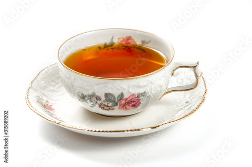 Cup of tea on a white background, closeup side view