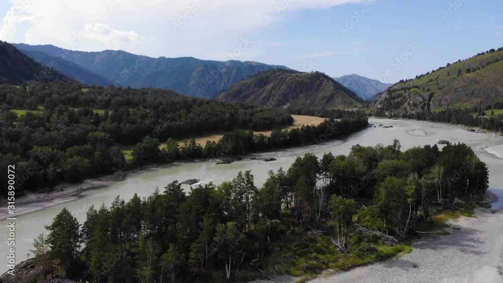Aerial view. The confluence of the river against the backdrop of the mountain landscape Aerial view. The confluence of the river against the backdrop of the mountain landscape