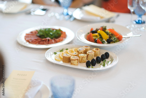 pancake rolls with olives and lemon