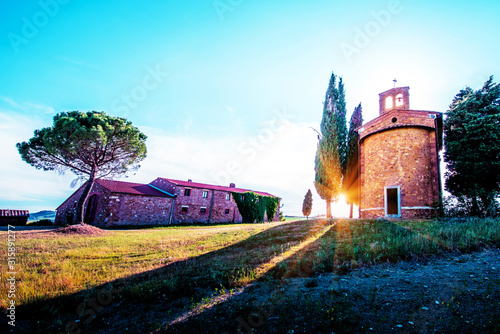Obraz na płótnie Magic landscape with chapel of Madonna di Vitaleta on a sunny day in San Quirico d'Orcia (Val d'Orcia) in Tuscany, Italy. Excellent tourist places. w salonie