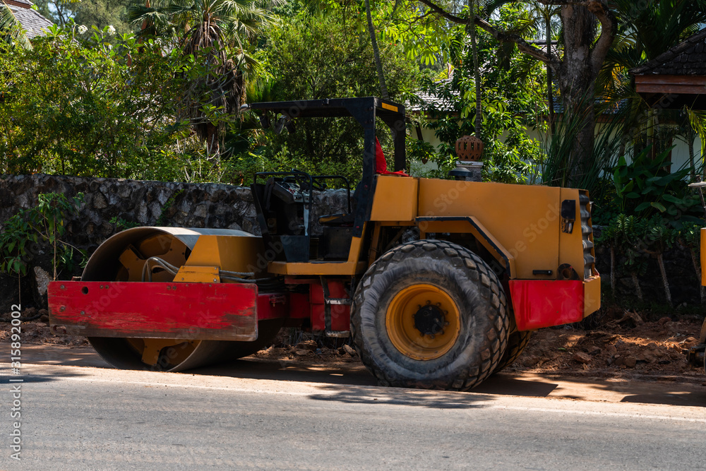 Road rollers working on the new roads construction site. Heavy duty machinery working on highway. Construction equipment. Compaction of the road.