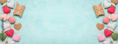 Valentine's Day background with colorful hearts and gift box