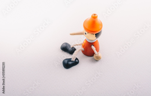 Wooden pinocchio doll with ...