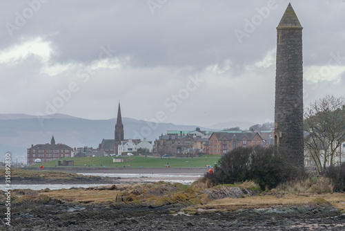 Largs Town and the Pencil Monument on a Hazy Wet Day in Scotland. photo