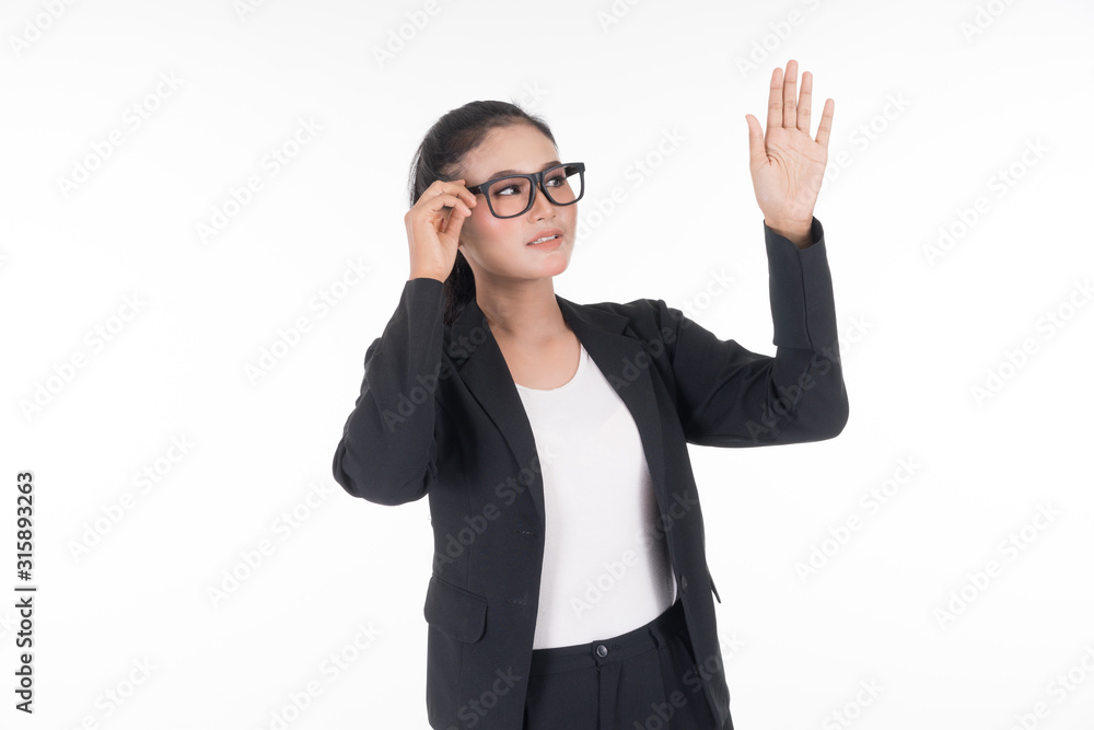 An attractive woman wearing business attire waving her hands in the air navigating on an invisible screen isolated on white. Suitable for image cut out and manipulation works for technology, business. An attractive woman wearing business attire waving her hands in the air navigating on an invisible screen isolated on white. Suitable for image cut out and manipulation works for technology, business.