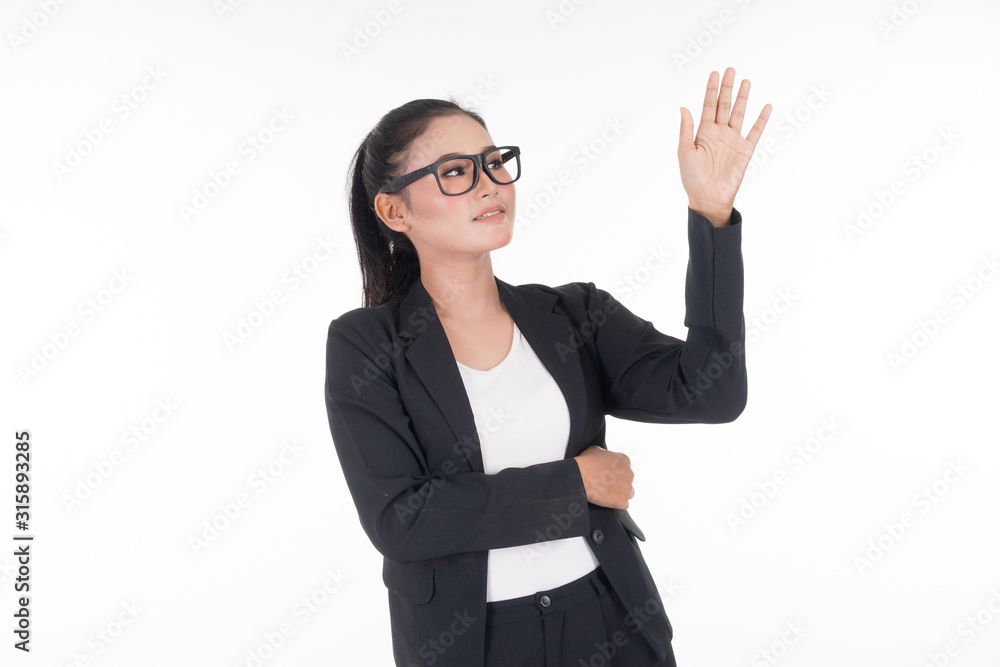 An attractive woman wearing business attire waving her hands in the air navigating on an invisible screen isolated on white. Suitable for image cut out and manipulation works for technology, business. An attractive woman wearing business attire waving her hands in the air navigating on an invisible screen isolated on white. Suitable for image cut out and manipulation works for technology, business.