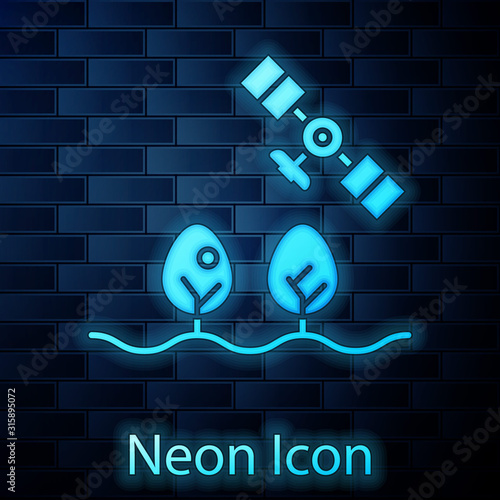 Glowing neon Smart farm with drone control and tree icon isolated on brick wall background. Innovation technology for agricultural company. Vector Illustration