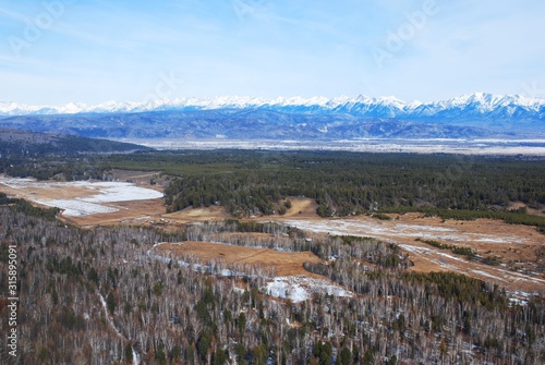 snowy mountains above a river valley