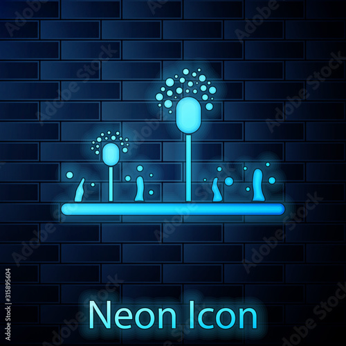 Glowing neon Mold icon isolated on brick wall background. Vector Illustration
